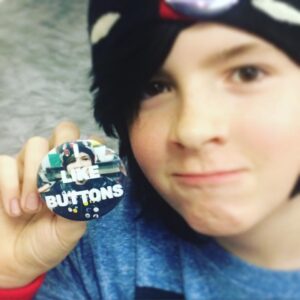 He made a button of himself wearing all his buttons that says, "I Like Buttons". It's very meta.
